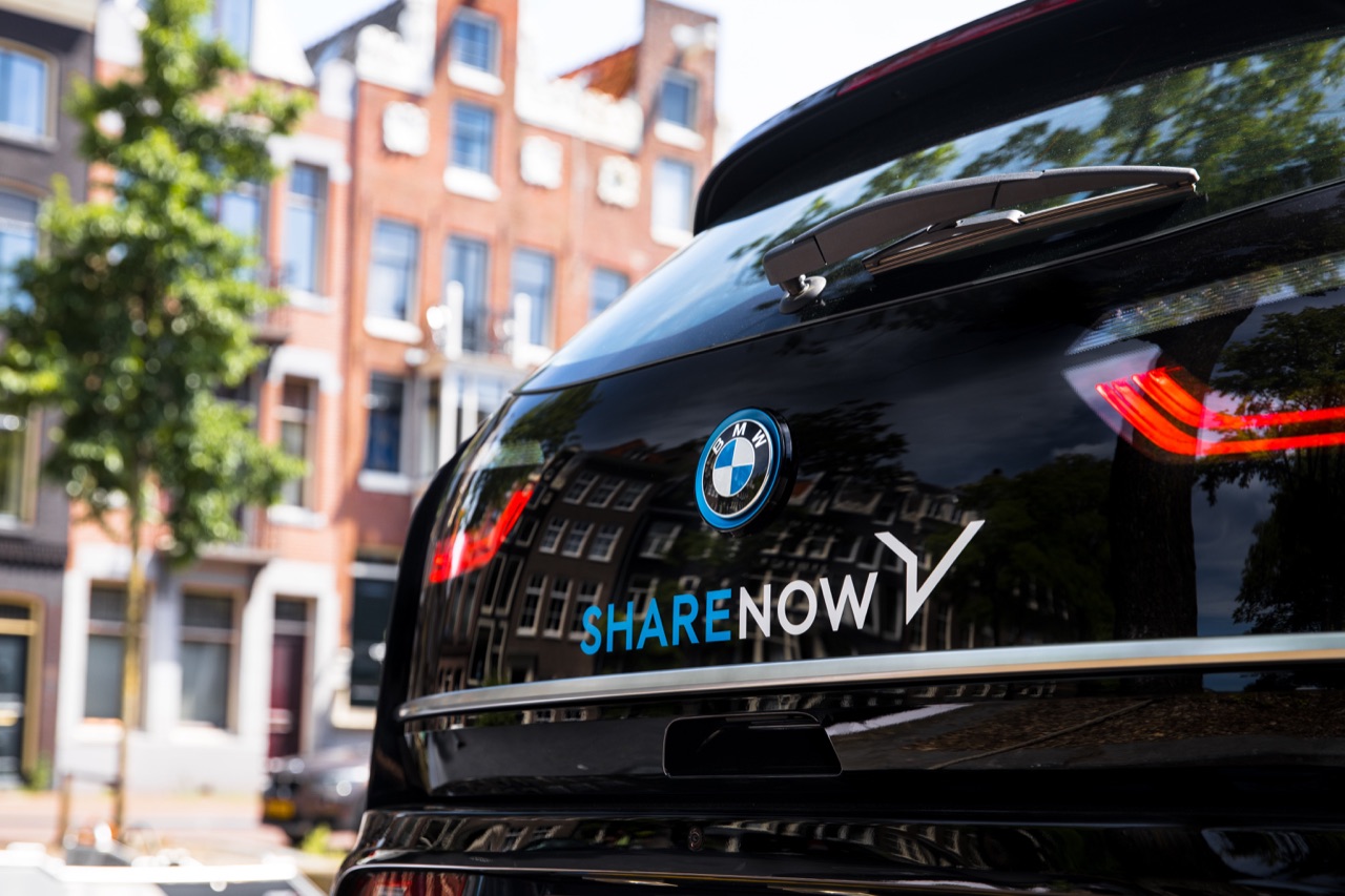 A car-sharing vehicle parked on a city street.