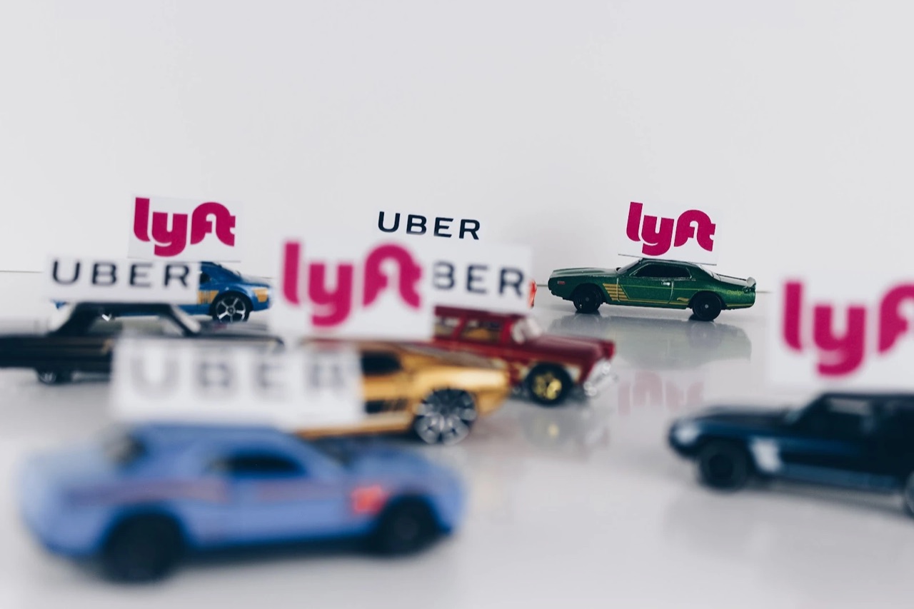 A colorful model car with rideshare-app signage.